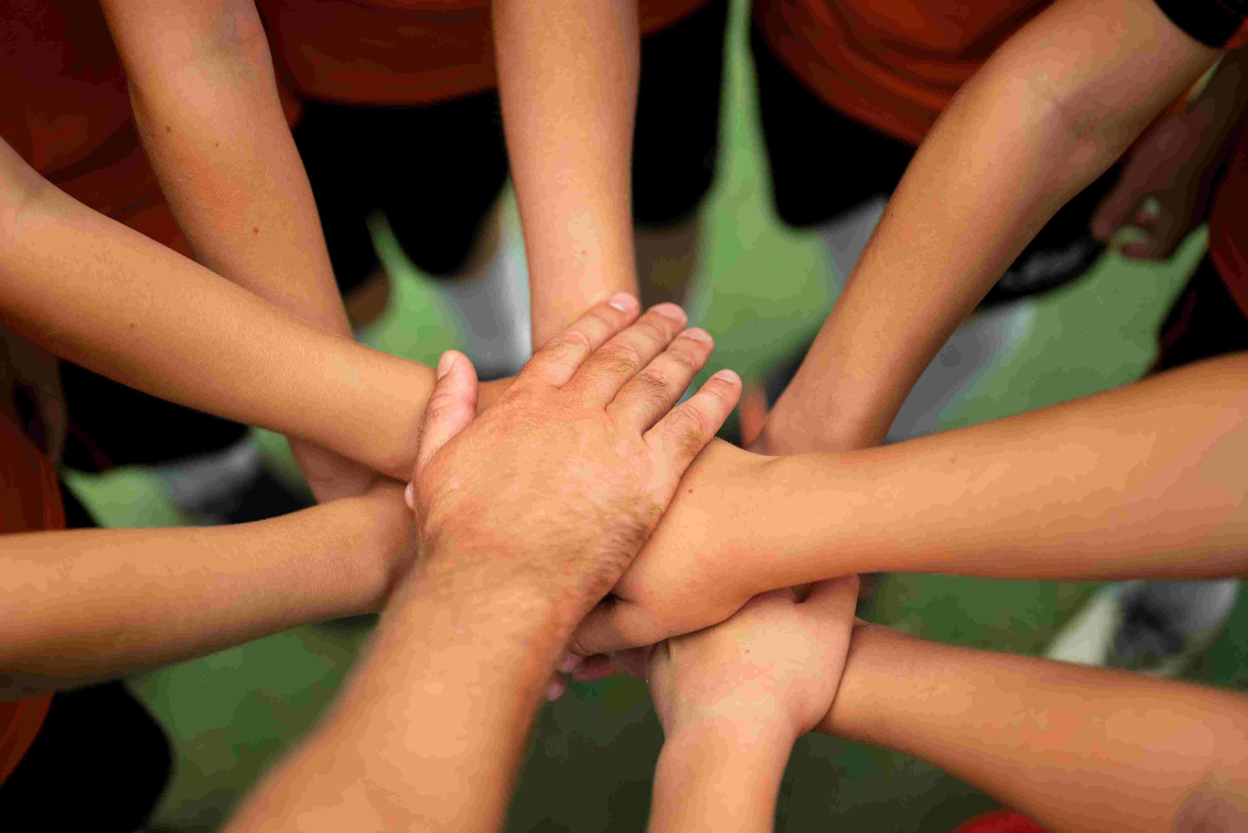 The picture is showing children holding / joining hands for a better cause. Non-profit organisation